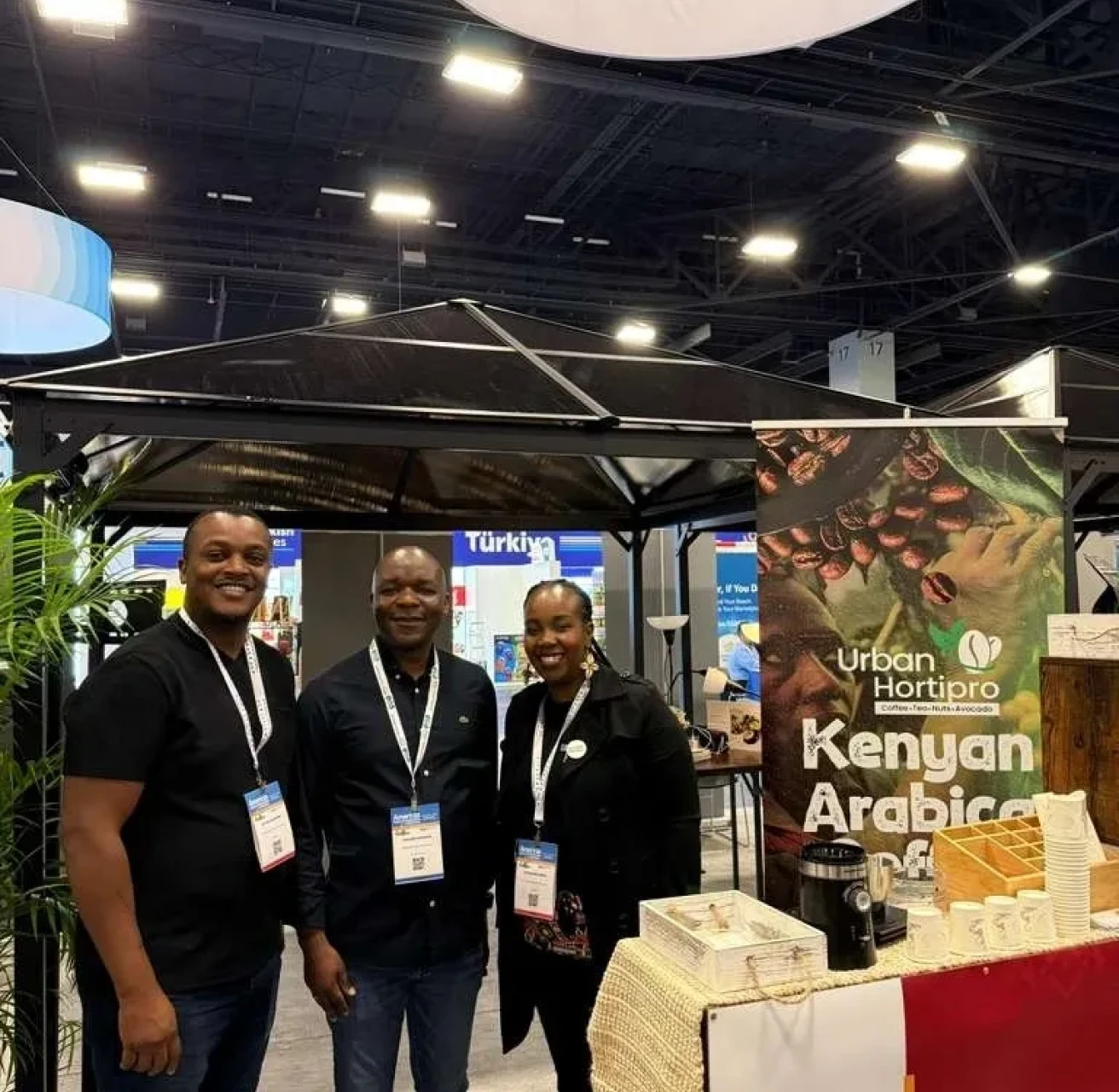 Kenyan Arabica coffee stand with attendees